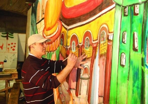Палестинський художник Джамаль Бадван на складі столичної оптової бази малює картину ”В безлічі — один”