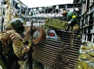 Захисники донецького аеропорту в ящиках з-під боєприпасів відправляють рештки загиблих танкістів