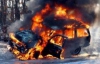 У Києві люди в спецодязі підпалювали авто 