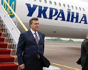 Янукович взял Тигипко в Германию 