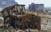 Цунами превратило японские города в груды досок и бетона