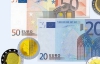 Євро коливається біля максимуму за 17 місяців у парі з доларом