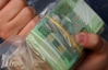 Лысый грабитель вынес из столичного банка 100 тысяч гривен