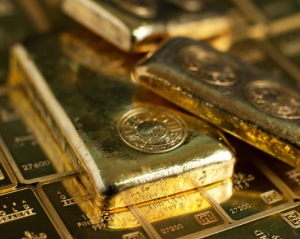 Цены на золото и серебро упали, доверие к доллару растет