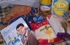 Онищенко раздает продуктовые пайки, другие кандидаты - школьные наборы