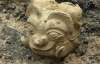 В Китае нашли голову божества с рогами и клыками