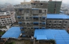 Китайці масово будують незаконні багатоповерхівки без комунікацій та освітлення