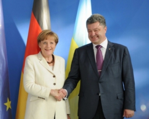 Меркель в Киеве попытается склонить Порошенко к миру - немецкая пресса