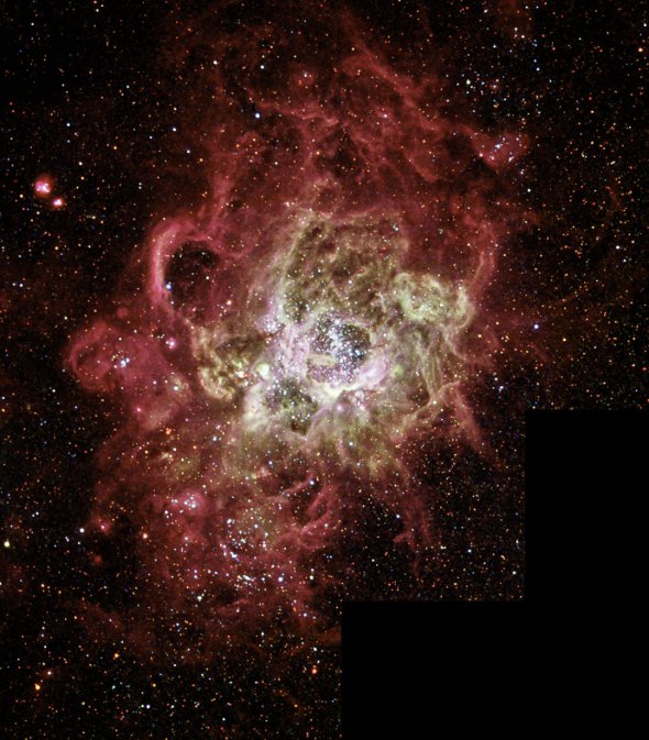 Ця кольорова туманність NGC 604 є одним із найвідоміших бурхливих місць, де народжуються зірки в сусідній галактиці. 