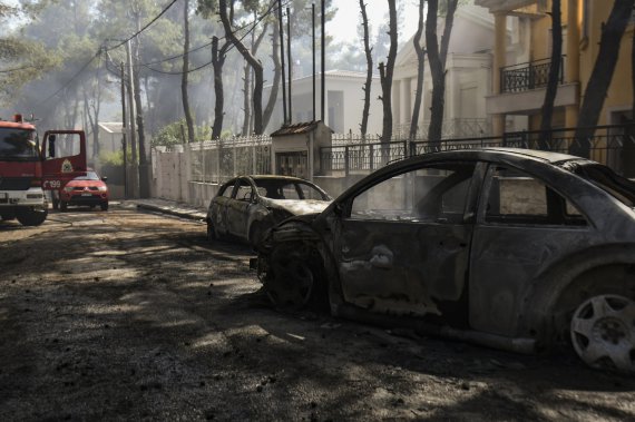 Последствия лесных пожаров в окрестностях Афин
