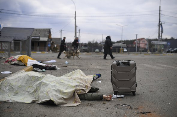 Погибшие от обстрелов россиян украинцы во время эвакуации из Ирпеня 