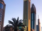 Окрашенные в золотой цвет 75-этажный Gevora Hotel в столице ОАЭ является самым высоким отелем в мире