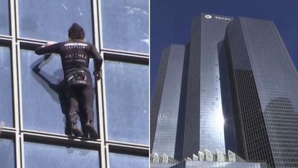 Французький скелелаз Ален Робер виліз на будівлю бізнес-центру "Тоталь" в районі Ля Дефенс, в Парижі.