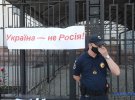Активісти проводять акцію протесту біля посольства Росії