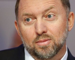 Порошенко при Меркель пообіцяв санкції проти російських олігархів